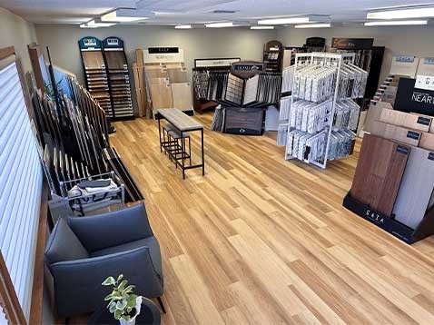 Store interior showcasing several different types of window coverings
