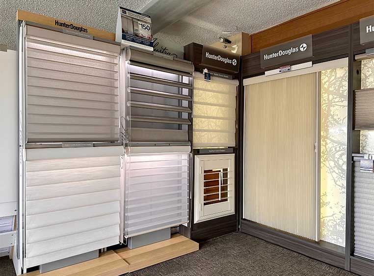 A display of multiple Hunter Douglas window coverings